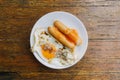 Easy breakfast set of fried egg and sausages in a dish Royalty Free Stock Photo