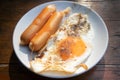 Easy breakfast set of fried egg and sausages in a dish Royalty Free Stock Photo