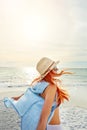 Easy, breezy, beachy days. Shot an attractive young woman enjoying a day at the beach.