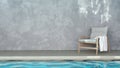 Easy chair with white towel on the side of swimming pool with rough concrete wall. The light reflected on pool water, make a