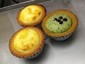 Easy and Delicious mini homemade tart, cream chesses, green tea, mango cream chesse on oven tray, mini pie