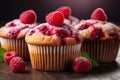 Easy homemade raspberry muffins with blurred kitchen background, ideal for text placement Royalty Free Stock Photo