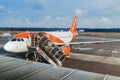 Easy Jet company airplane and boarding stairs, preparations before flight in Malpensa Airport
