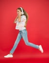 Easy listening music. Small girl listening to music in headphones. Dancing girl. Happy small girl dancing. Cute child Royalty Free Stock Photo