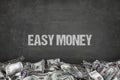 Easy money text on black background Royalty Free Stock Photo