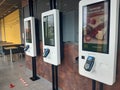 Easy order machines inside an empty McDonalds restaurant in Paris.