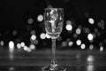 Easy recipes for winter alcoholic cocktail drinks. Cocktail glass on defocused garland colorful lights. What to drink on Royalty Free Stock Photo