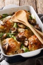 Easy smothered chicken with bok choy and mushrooms close-up. Vertical Royalty Free Stock Photo