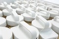 Easy-to- carry white plastic cap of acrylic bottle in rows for p