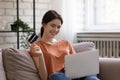 Happy Millennial Woman Pay For Goods Online Using Credit Card