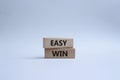 Easy win symbol. Wooden blocks with words Easy win. Beautiful white background. Business and Easy win concept. Copy space Royalty Free Stock Photo