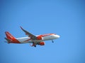 EasyJet airplane flying at blue sky