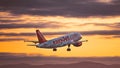 EasyJet airplane a320 flying in the sky at sunset