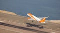 EasyJet Airplane taking off from the airport during morning. Aerial View from Rock of Gibraltar