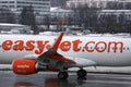 Easyjet landing in Innsbruck Airport, INN, snow in winter Royalty Free Stock Photo