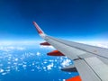 Easyjet logo on airplane wing of Easyjet airplane flying over t Royalty Free Stock Photo