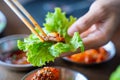 Eat BBQ grilled pork with vegetable wrap korean style Royalty Free Stock Photo