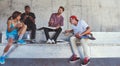 Eat, chill and skate. a group of skaters having lunch together.