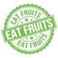 EAT FRUITS text on green round stamp sign