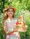 Eat healthy. Cute girl child with basket fruits nature background