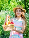 Eat healthy. Cute girl child with basket fruits nature background