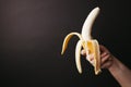 Woman snacking with banana, free space