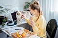 Eat Healthy While Working From Home. Healthy lunches work from home. Woman Freelancer eating Healthy Grain Snacks and Royalty Free Stock Photo