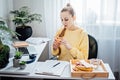 Eat Healthy While Working From Home. Healthy lunches work from home. Woman Freelancer eating Healthy Grain Snacks and Royalty Free Stock Photo