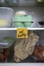 Eat healthy written on a post it note stuck on a fridge shelf Royalty Free Stock Photo