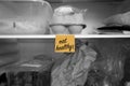 Eat healthy written on a post it note stuck on a fridge shelf with food Royalty Free Stock Photo