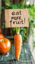 Eat more fruit sign on a carrot Royalty Free Stock Photo