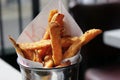 Freshly made sweet potato chips in a metal pot are ready to eat Royalty Free Stock Photo