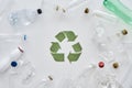 Eat, Sleep, Recycle. Flatlay composition with different empty plastic bottles and conceptual recycling sign made of