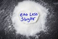 eat less sugar for health concept Heap of white sugar on dark background