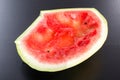 Eaten watermelon on a black background Royalty Free Stock Photo