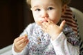 Eating baby girl with messy face Royalty Free Stock Photo