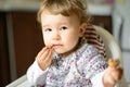 Eating baby girl with messy face Royalty Free Stock Photo