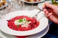 Eating beetroot risotto Royalty Free Stock Photo