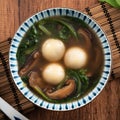 Eating big tangyuan yuanxiao with savory soup in Taiwan