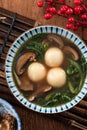 Eating big tangyuan yuanxiao with savory soup in Taiwan