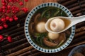 Eating big tangyuan yuanxiao with savory soup in Taiwan