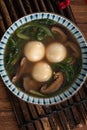 Eating big tangyuan yuanxiao with savory soup in Taiwan