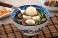 Eating big tangyuan yuanxiao with savory soup in Taiwan