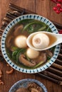 Eating big tangyuan yuanxiao with savory soup in Taiwan