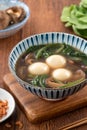 Eating big tangyuan yuanxiao with savory soup in Taiwan