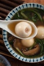 Eating big tangyuan yuanxiao with savory soup in Taiwan