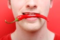 Eating chili pepper Royalty Free Stock Photo