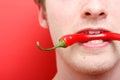 Eating chili pepper Royalty Free Stock Photo