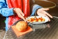 Eating Currywurst with bread in Berlin street food cafe. Local german cuisine concept Royalty Free Stock Photo