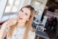 Eating delicious ice-cream happy smiling beautiful young business woman cute blond girl having fun and relaxing looking at camera Royalty Free Stock Photo